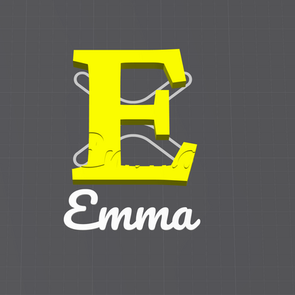 A digital preview of a custom SVG cut file for a planner, showing a large yellow letter 'E' with white interlocking puzzle-piece outlines and the name 'Emma' in white script below, displayed within the SparkX design software interface.