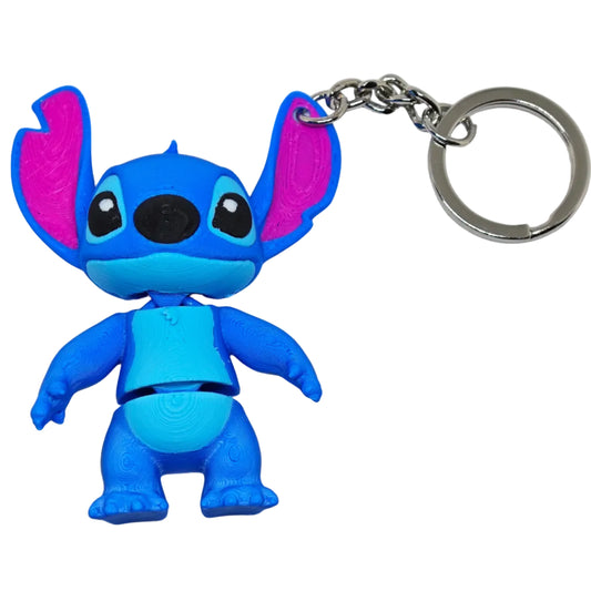 Blue cartoon character keychain with pink accents on a white background